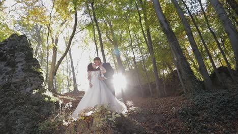 Groom-with-bride-in-the-forest-park.-Wedding-couple.-Happy-family