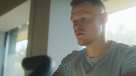 man having cycling workout in gym