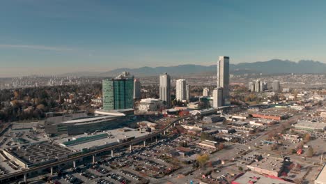 drone 4k footage above surrey panoramic shot of a city center of high rise buildings downtown cityscape maintaining air quality