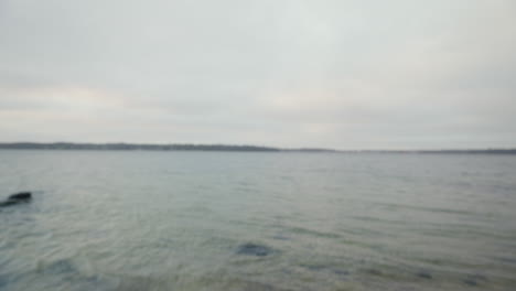 runner gazing at the sea, deep in thought, preparing for jog