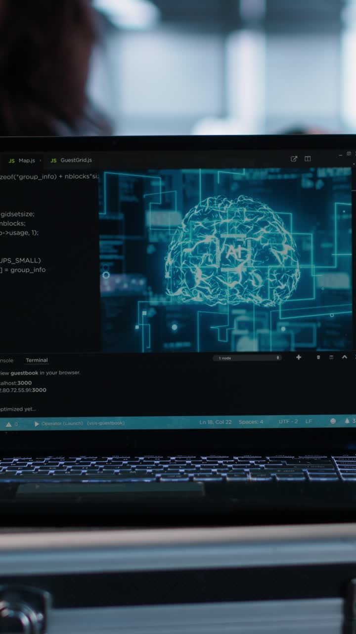 Vertical video AI coding on notebook screen next to technicians inspecting servers, close up