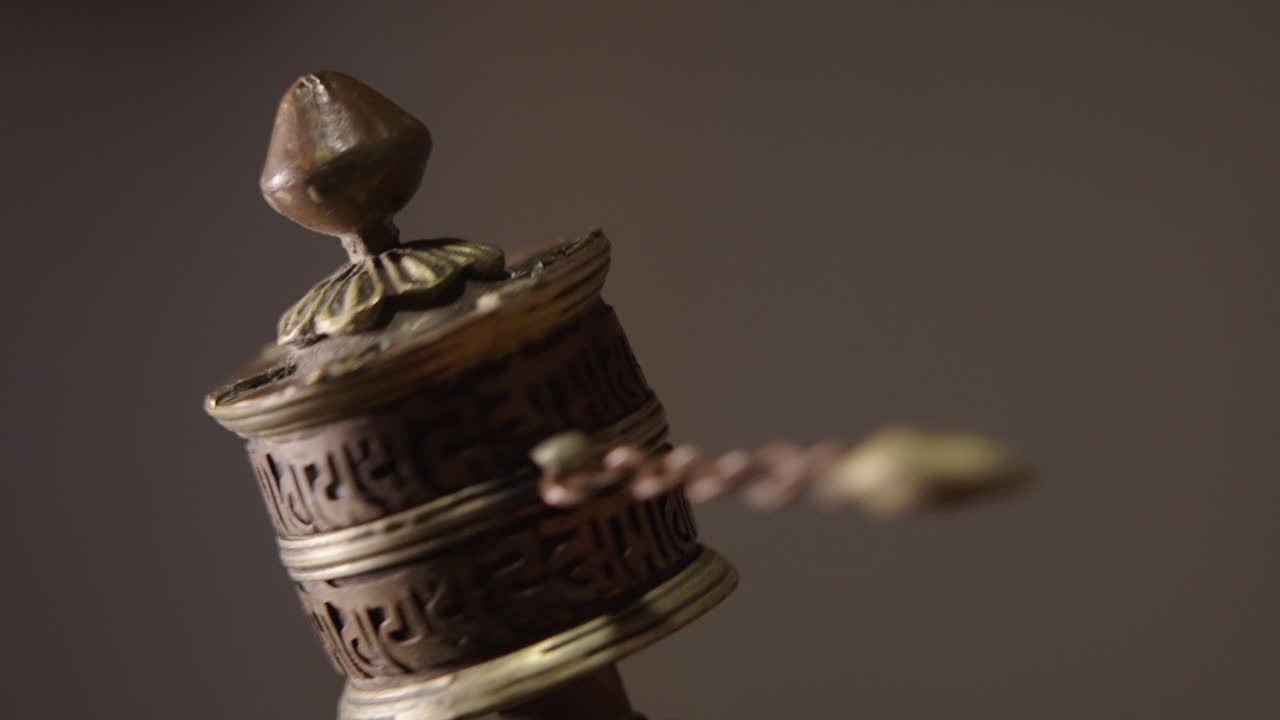 Close-up of an Ornate Tibetan Prayer Wheel Spinning