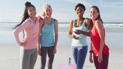 Portrait-of-happy-group-of-diverse-female-friends-having-fun-at-the-beach