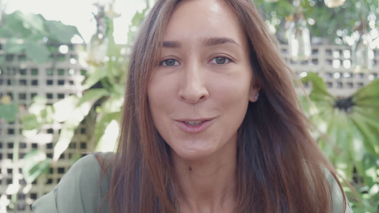 Young Woman Talking on Camera Outdoors