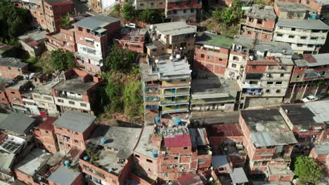 Tilt-up aerial shot showing densely packed homes in Petare, Miranda, Venezuela