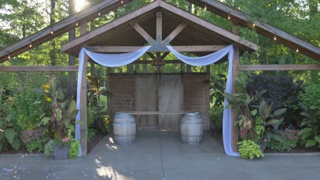 Walking-down-empty-wedding-aisle-in-Summer-with-sun-beaming-through-trees