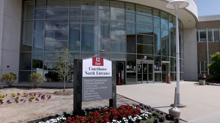 Oakland County Courthouse in Michigan at north entrance with gimbal video walking forward