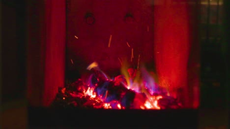 fireplace with burning woods giving warm inside the room on a cold night