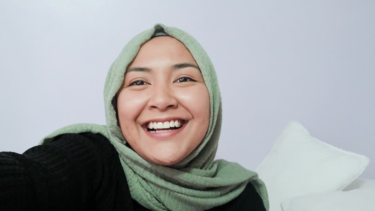 Female Student Waving Talking and Waving Directly to Camera