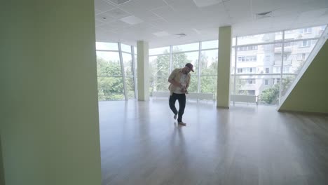 man breakdancing in modern studio