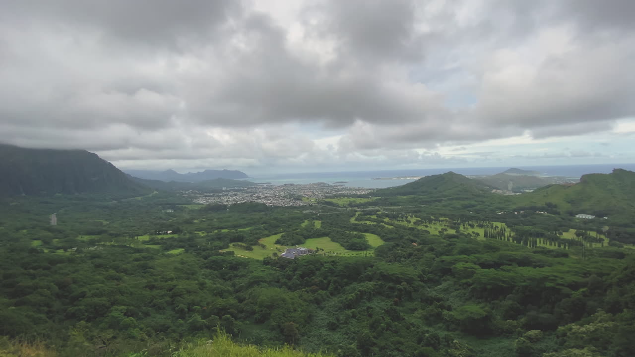 Breathtaking Aerial View of Lush Tropical Valley and Ocean