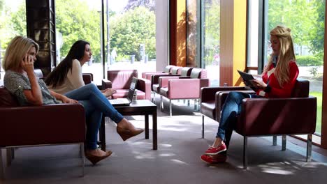 classmates using digital tablet smartphone and laptop