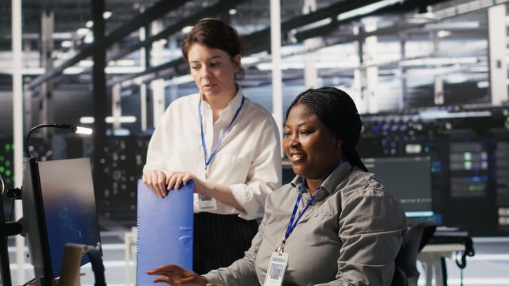 Vertical video Happy data center manager pleased by work done by team integrating AI