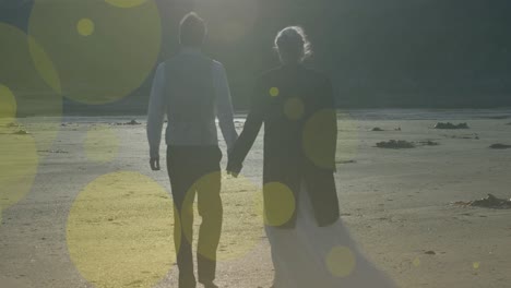 animación de puntos de luz sobre una pareja caucásica caminando y tomados de la mano