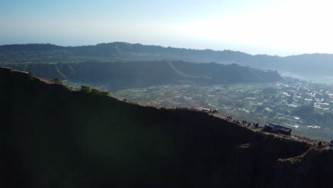 Mountains-emerge-from-shadows,-peaks-dusted-with-first-blush-of-morning