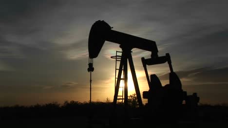 medium shot of an oil pump turning in the new mexico desert 3