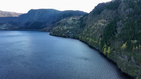 Bay-of-Langhelle,-Old-Bergen-railway-and-road-E16-seen-in-hillside,-Aerial