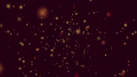 animación de manchas amarillas y rojas de luz volando en movimiento hipnótico sobre fondo negro