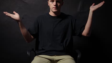 shot of a man shrugging and giving an "i don't know" gesture with his arms and hands