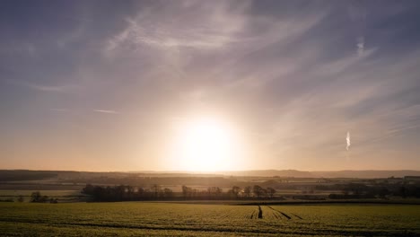 Wide-view-of-golden-sunrise-in-a-rural-area-of-Scotland-in-winter-in-Perth-Shire,-United-Kingdom