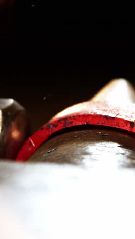 close-up of blacksmith working on a iron rod