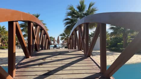 pov walking inside a luxury resort with swimming pool and palm tree