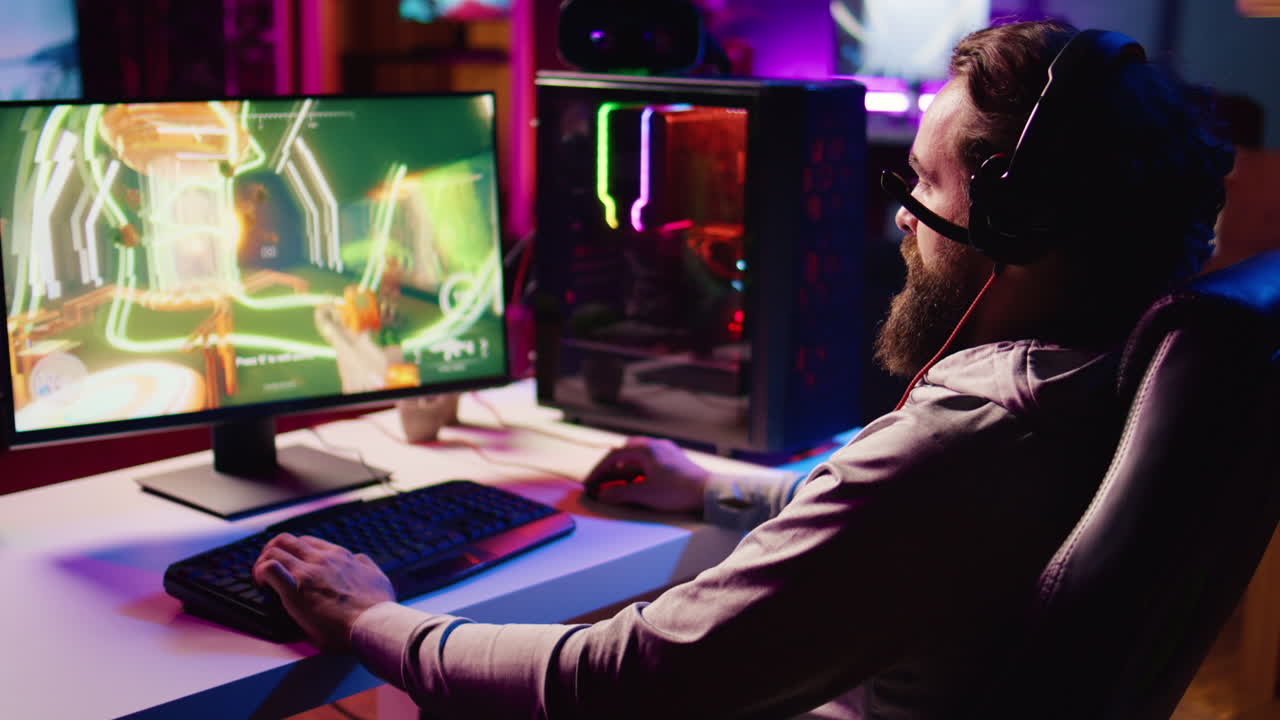 Cheerful man achieving victory in gaming session, overflowing with joy