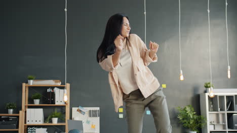 woman dancing in office