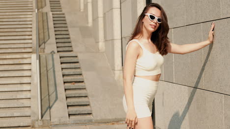 woman in a stylish cream-colored outfit