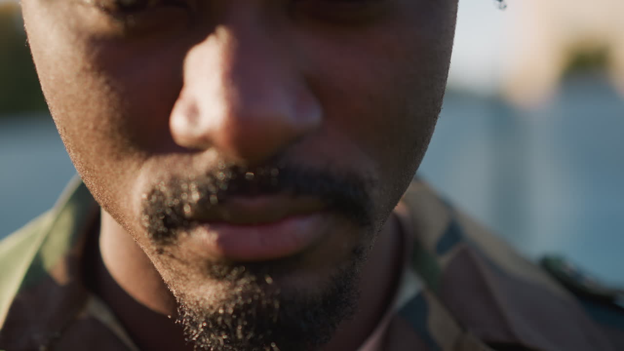 Veteran In Camouflage, Black Soldier During Sunset Reflection, Close Examination Of Camouflaged Veteran At Sunset, Individual In Military Attire Reflecting During Golden Hour Closeup Shot