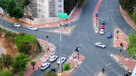 time lapse aerial shot of traffic moving through an intersection in santon south africa