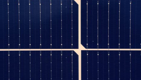 array of solar panel cells, top down motion view