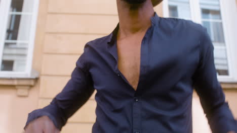 Smiling-Afro-Caribbean-Man-With-Panama-Hat-Dancing-Salsa-Alone-In-Street-1