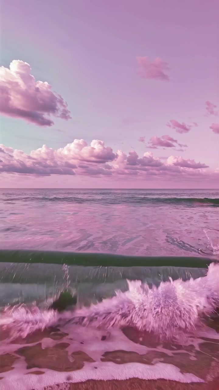 Dreamy Pink Ocean Waves Crashing on the Shore
