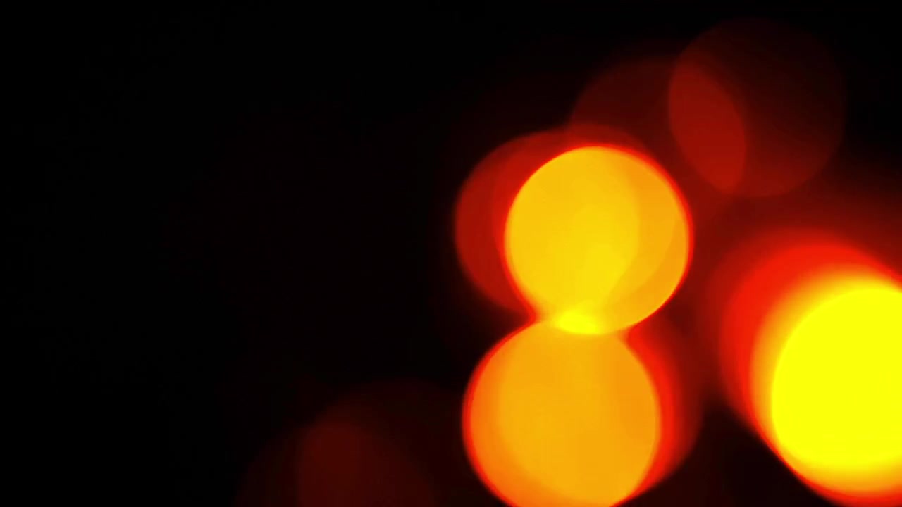 Fond abstrait de lumières bokeh rouges et jaunes lumineuses