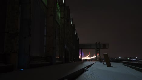 illuminated industrial building at night in winter