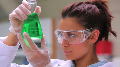 woman studying the liquid