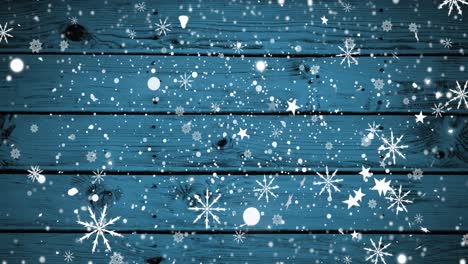 Animation-of-white-christmas-snowflakes-and-snow-falling-over-blue-wooden-boards