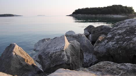 sun reflecting in the sea on coast with no people