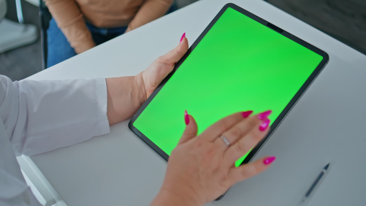 Doctor using tablet with green screen