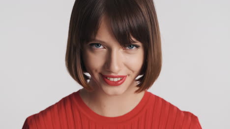 female model with red lips smiling