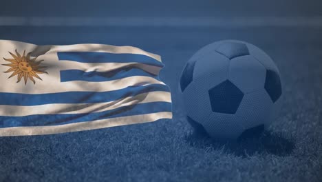 animation of flag of uruguay and football over stadium