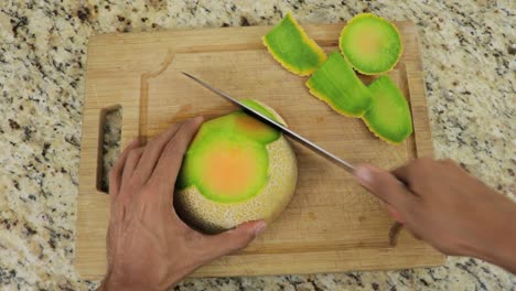 removing peel from melon using sharp knife