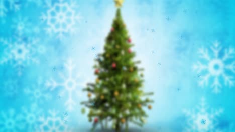 Animation-of-snow-falling-over-christmas-tree-on-blue-background