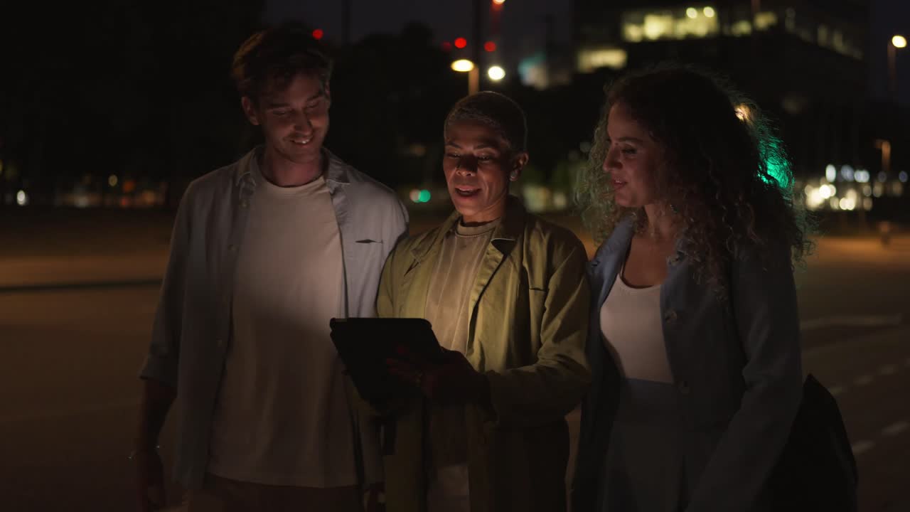 Group of People with Tablet at Night