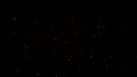 las partículas de oro fondo sin costuras. vj bucle sin costura. brillo brillante brillo efecto confeti. fondo de movimiento abstracto 4k. chispas de naranja vuelan hacia arriba