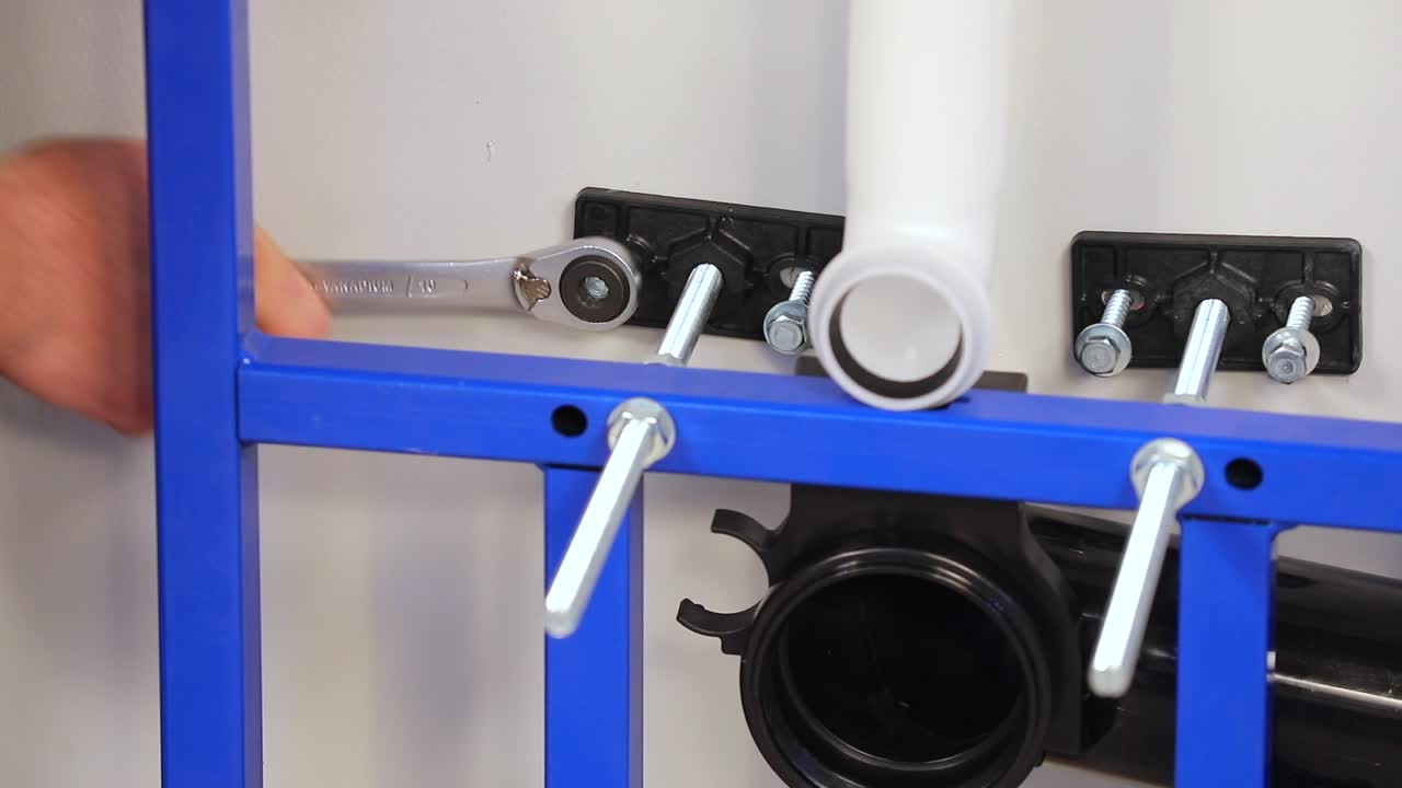 the worker who repairs and installs the toilet bowl and flush uses tools such as pliers and spanners