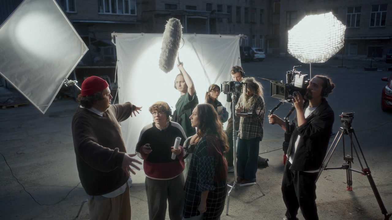 Film Crew and Cast Members Preparing Scene on Outdoor Movie Set