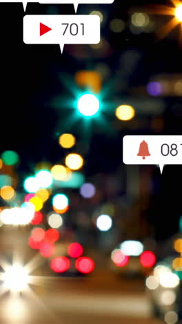 animación de iconos de redes sociales y números fuera de foco de la ciudad y las luces de los coches