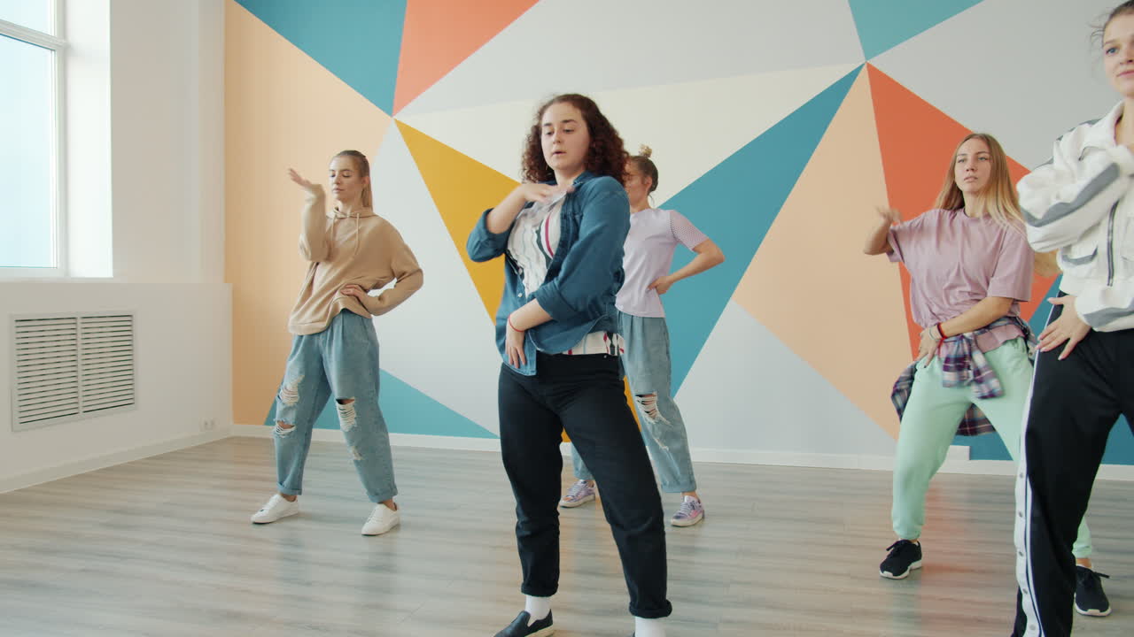 Teenagers Dancing in a Dance Studio
